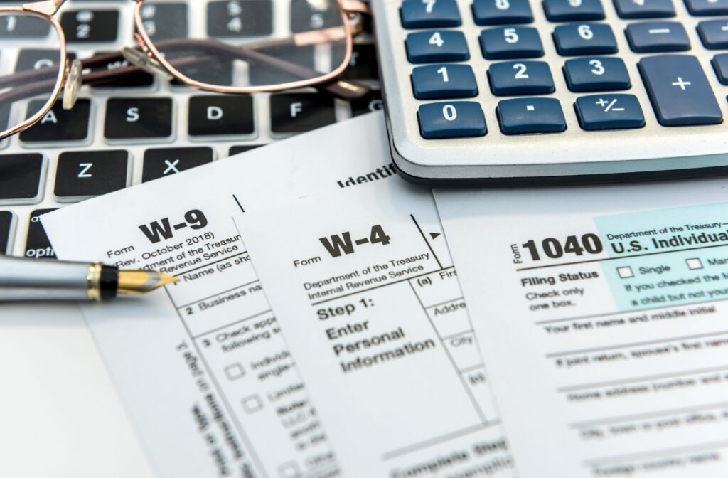 Close-up image showing the necessary forms required to submit for the end of tax season.