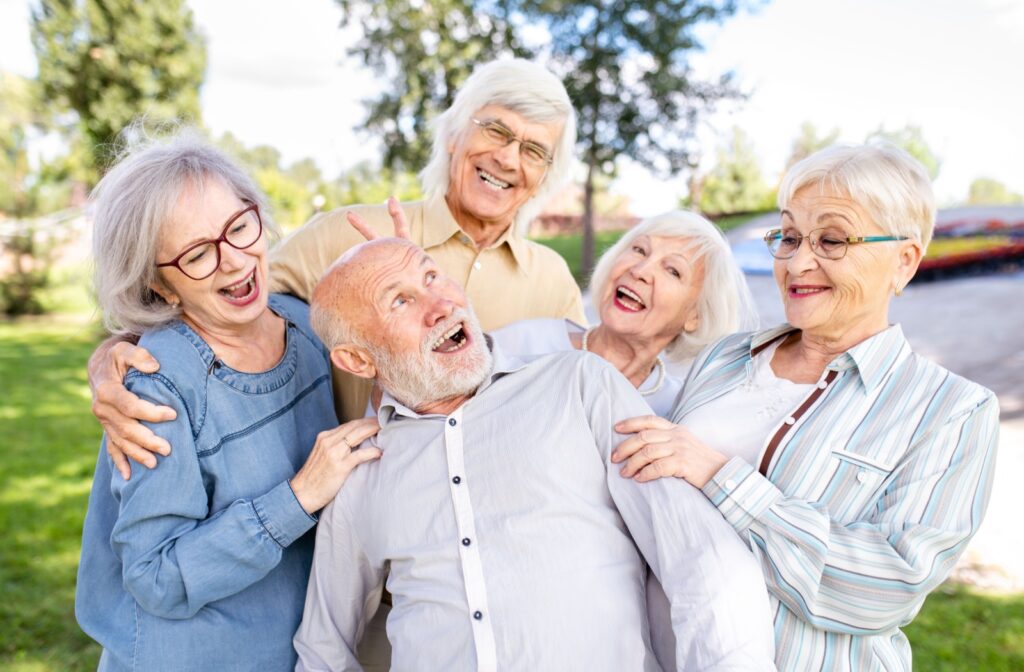 A group of happy seniors bonding and smiling.